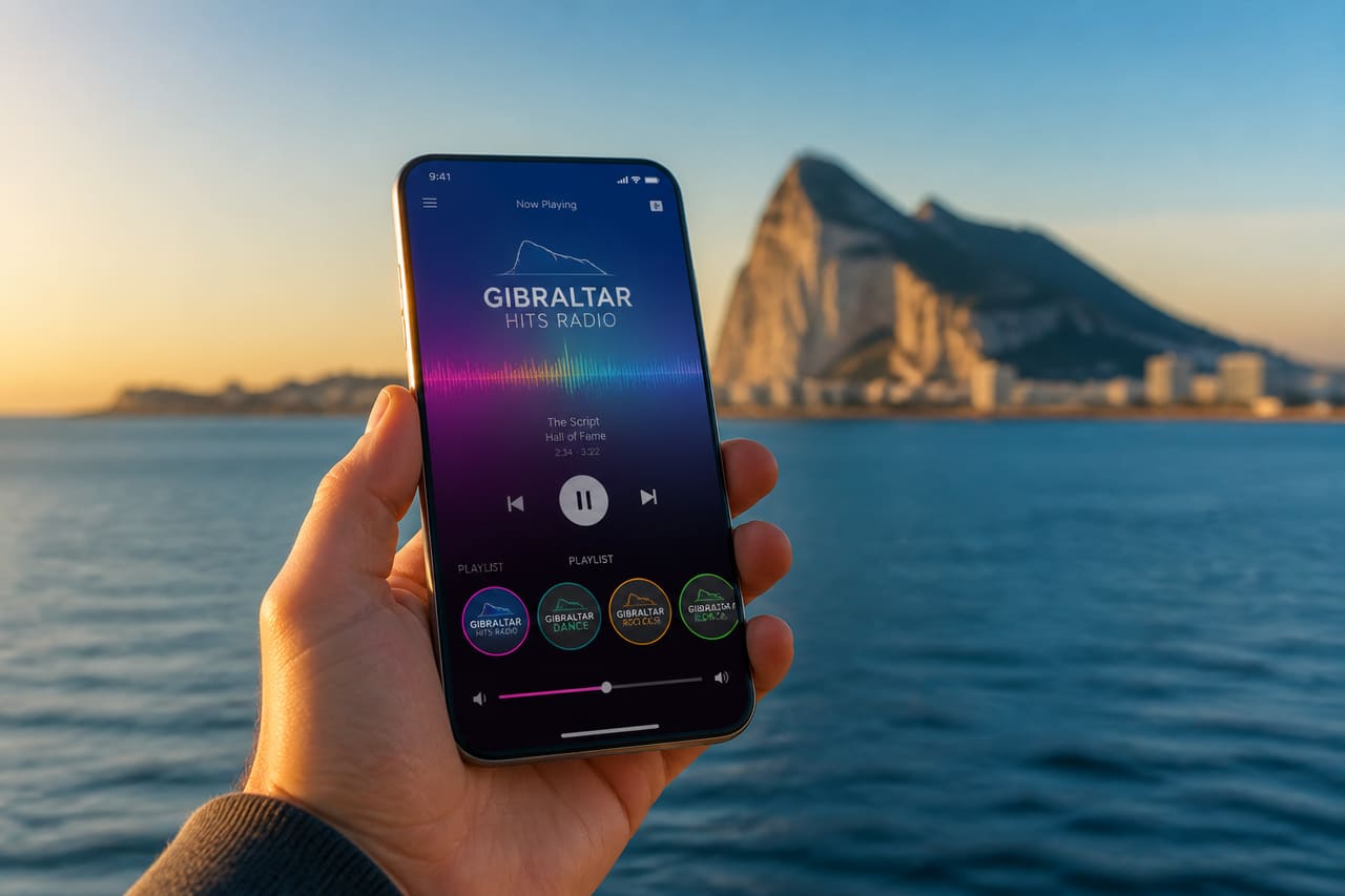 Smartphone Displaying a Radio Station App in a Coastal Setting