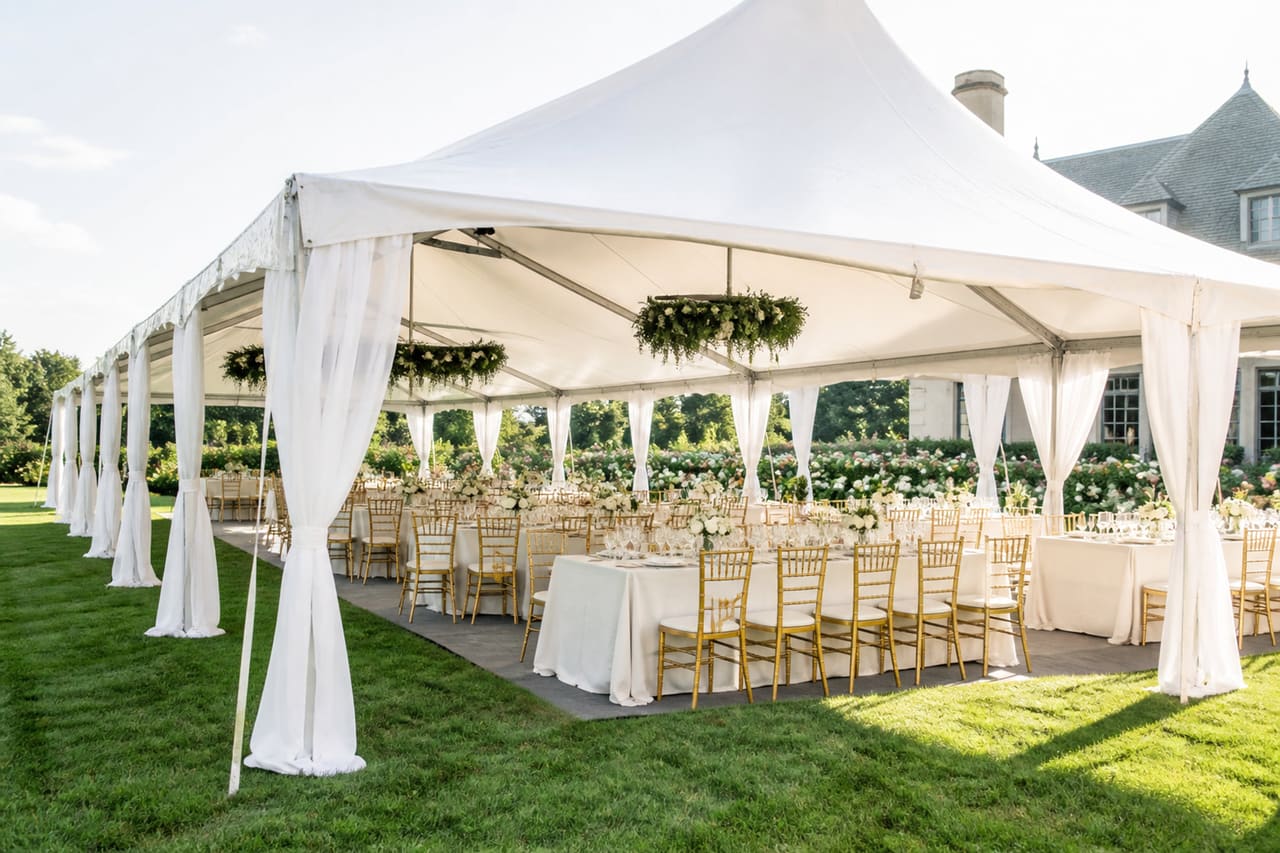 Large White Event Marquee Set Up on Luxury Estate Lawn