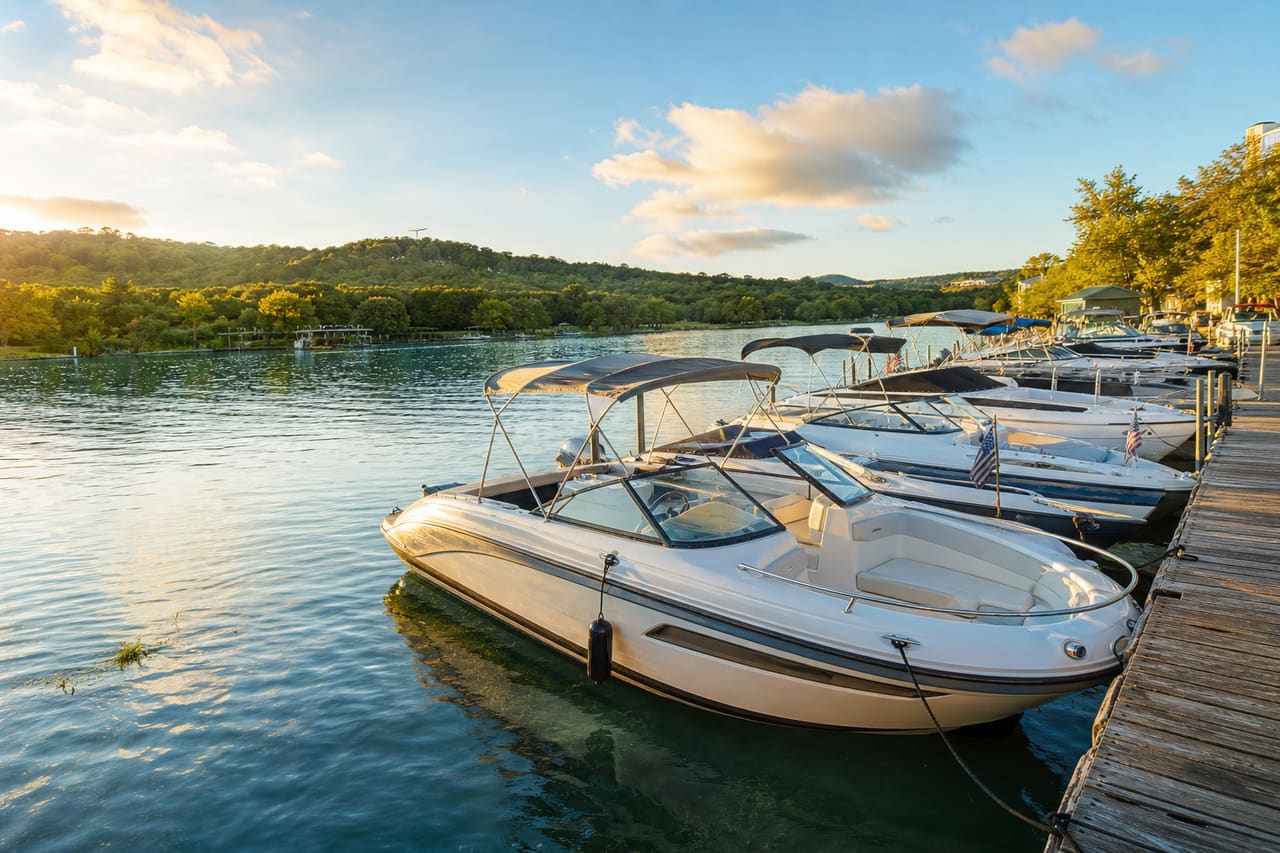 Luxury Motorboats Docked at a Waterfront Marina in Boat Town