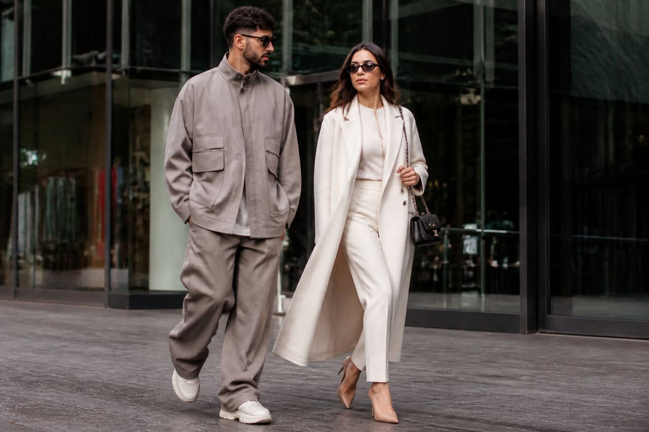 Fashionable Man and Woman Walking in Urban City Center