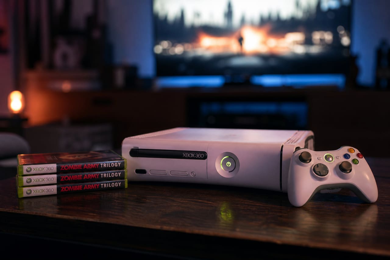 Xbox 360 Console and Zombie Army Trilogy Game Cases