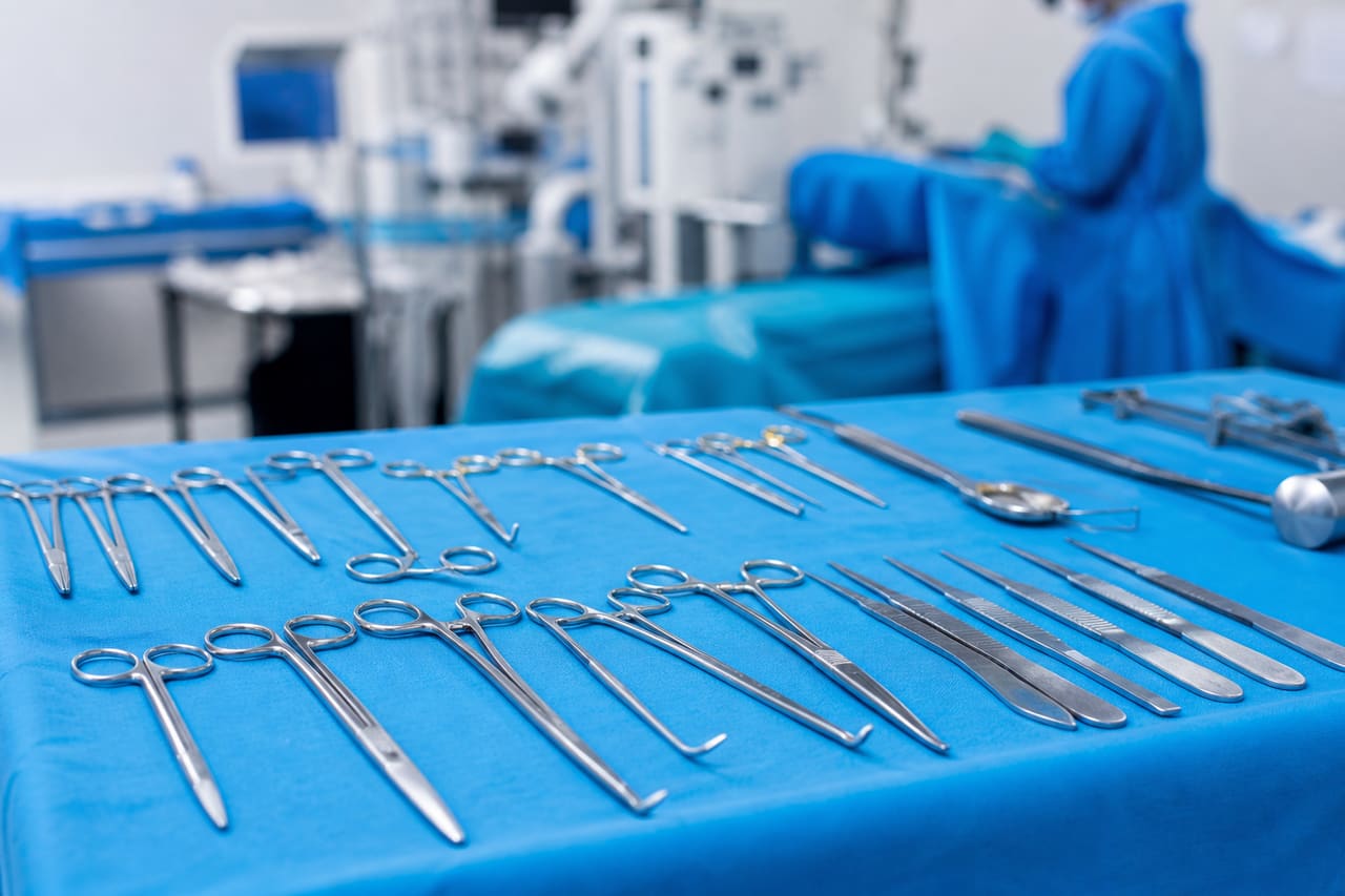 Professional Surgical Instruments Set on a Sterile Blue Tray
