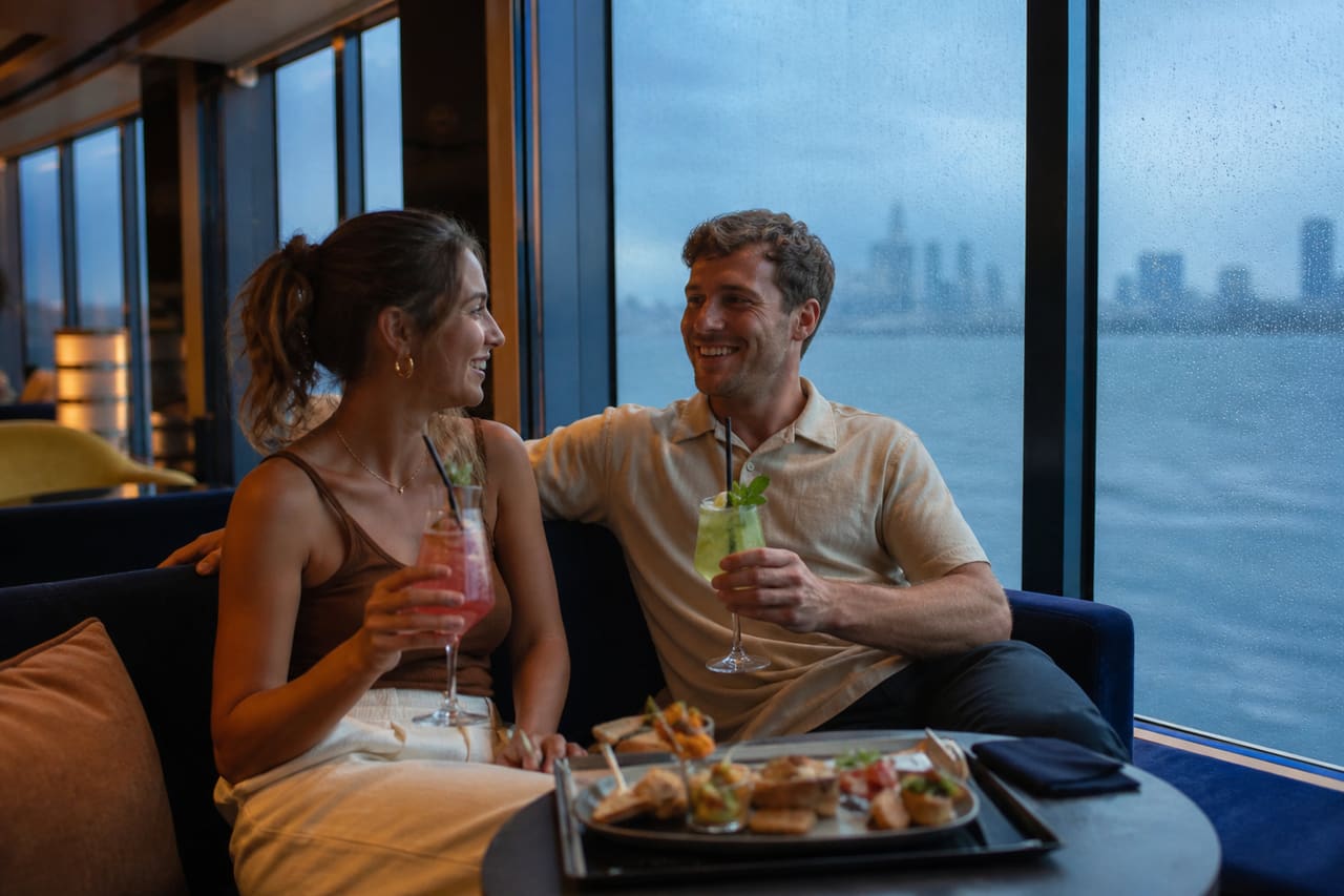 Couple Relaxing in Cruise Ship Lounge During Rain