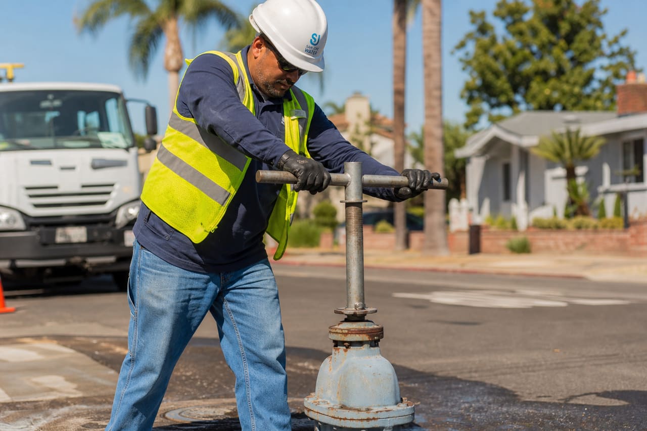 Water Utility Worker Inspecting Main Valve in San Jose