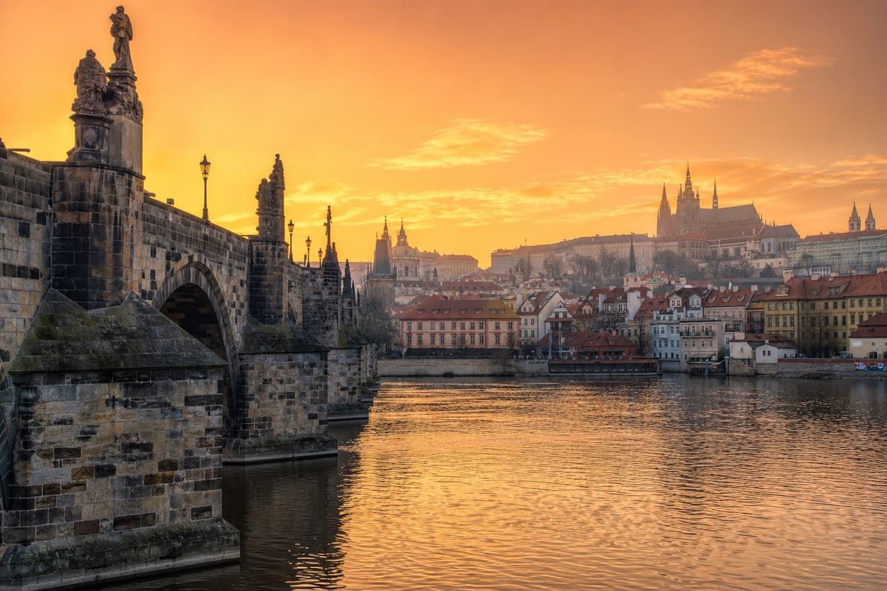 Panoramic View of Charles Bridge and Prague Castle at Sunrise