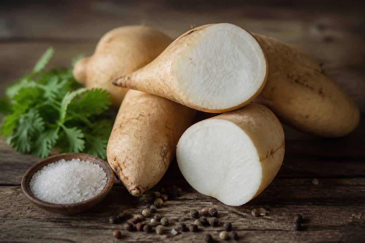 Raw Indian Sweet Potato Tubers on a Rustic Wooden Table