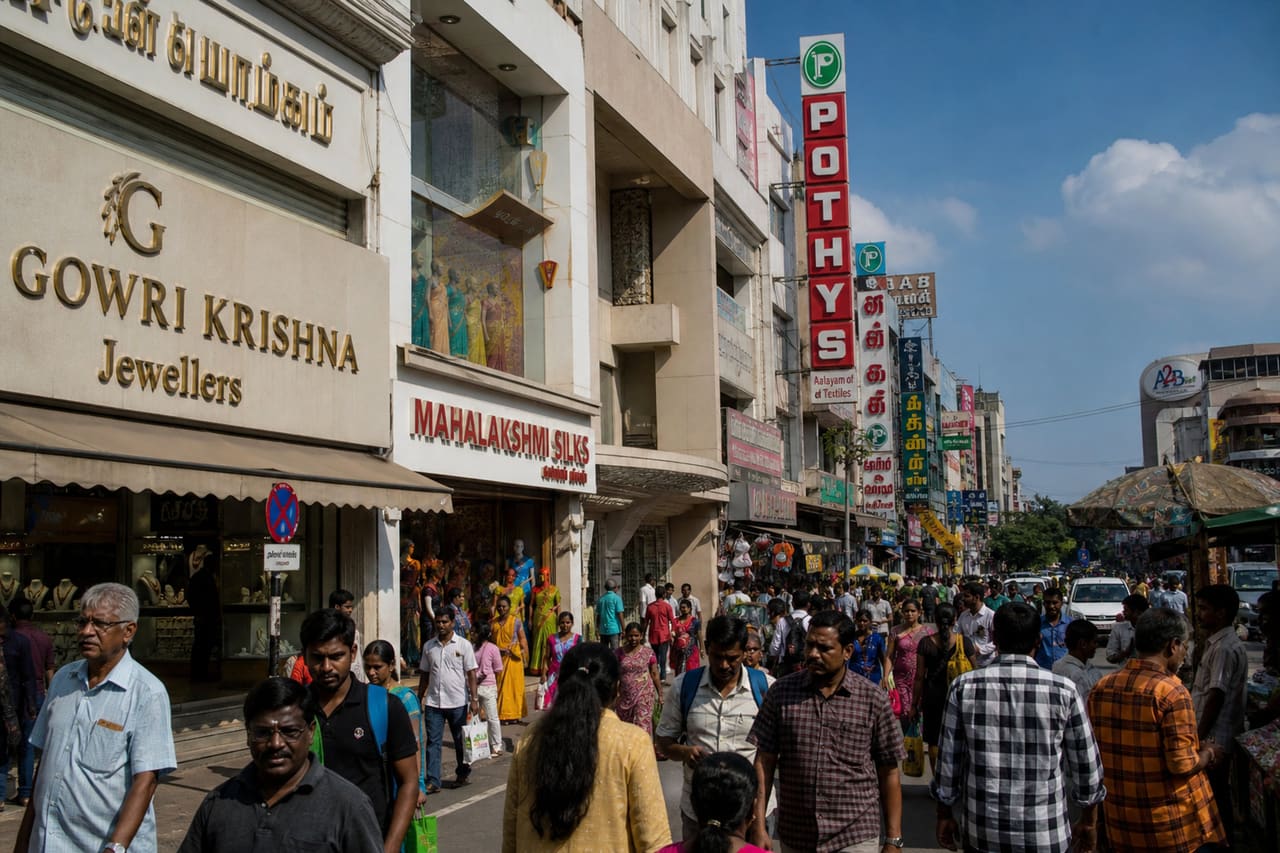 People Shopping Along a Busy Commercial Street in Gandhipuram