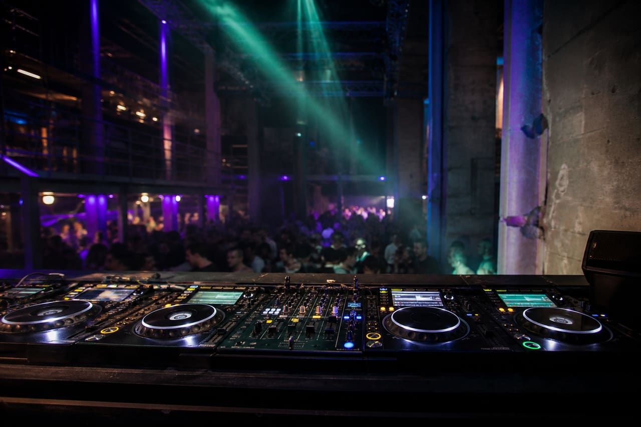 Dj Performing Tech House in an Amsterdam Warehouse Club