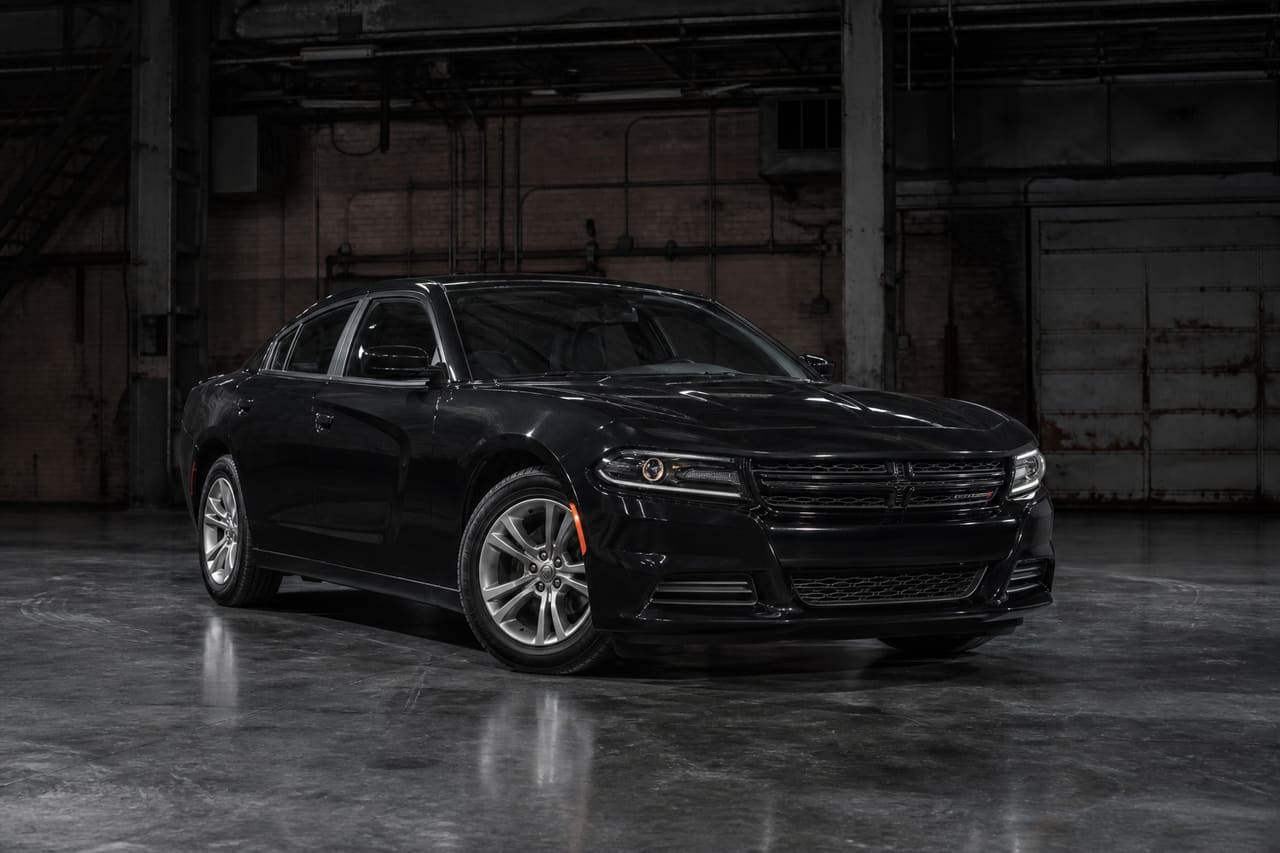 Black 2016 Dodge Charger Se Parked in Industrial Warehouse