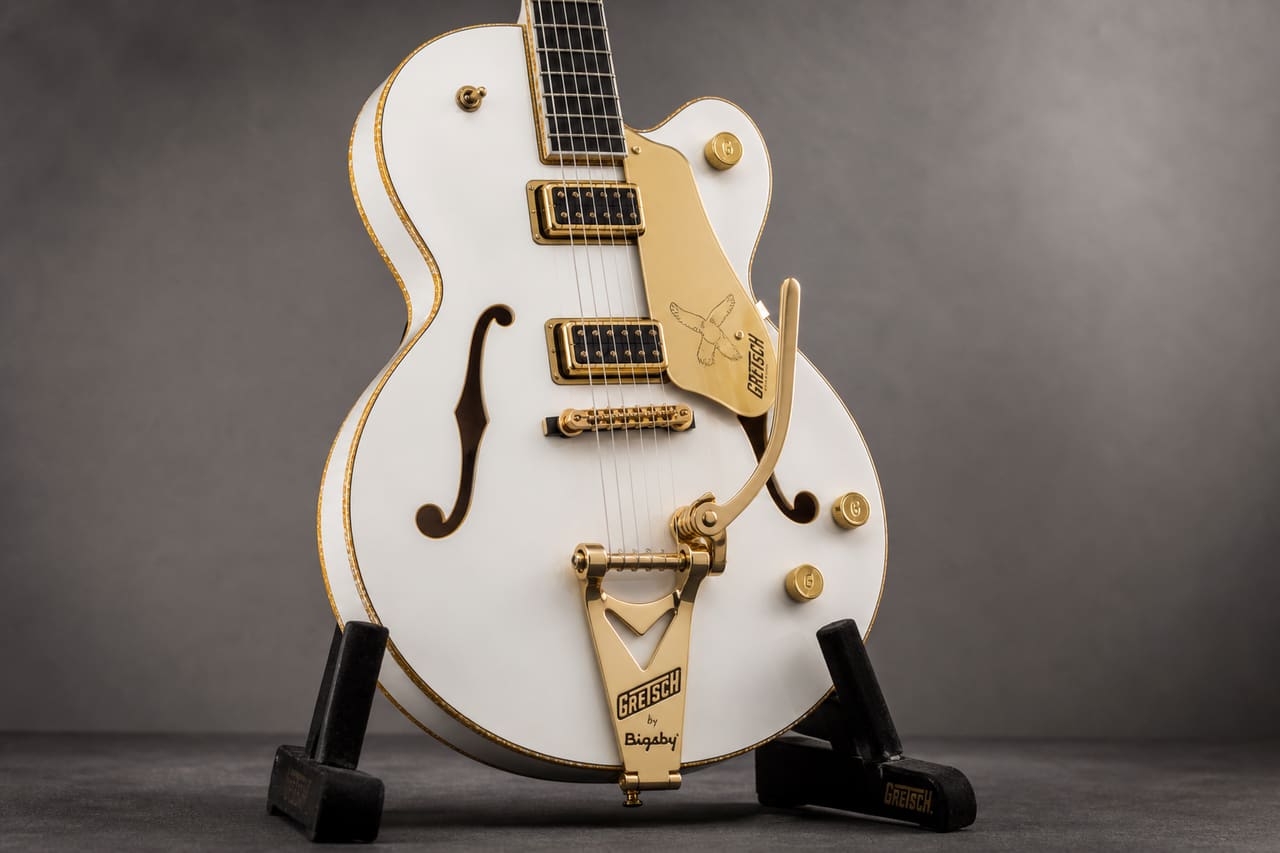 White Gretsch Falcon Jr Electric Guitar on a Velvet Stand