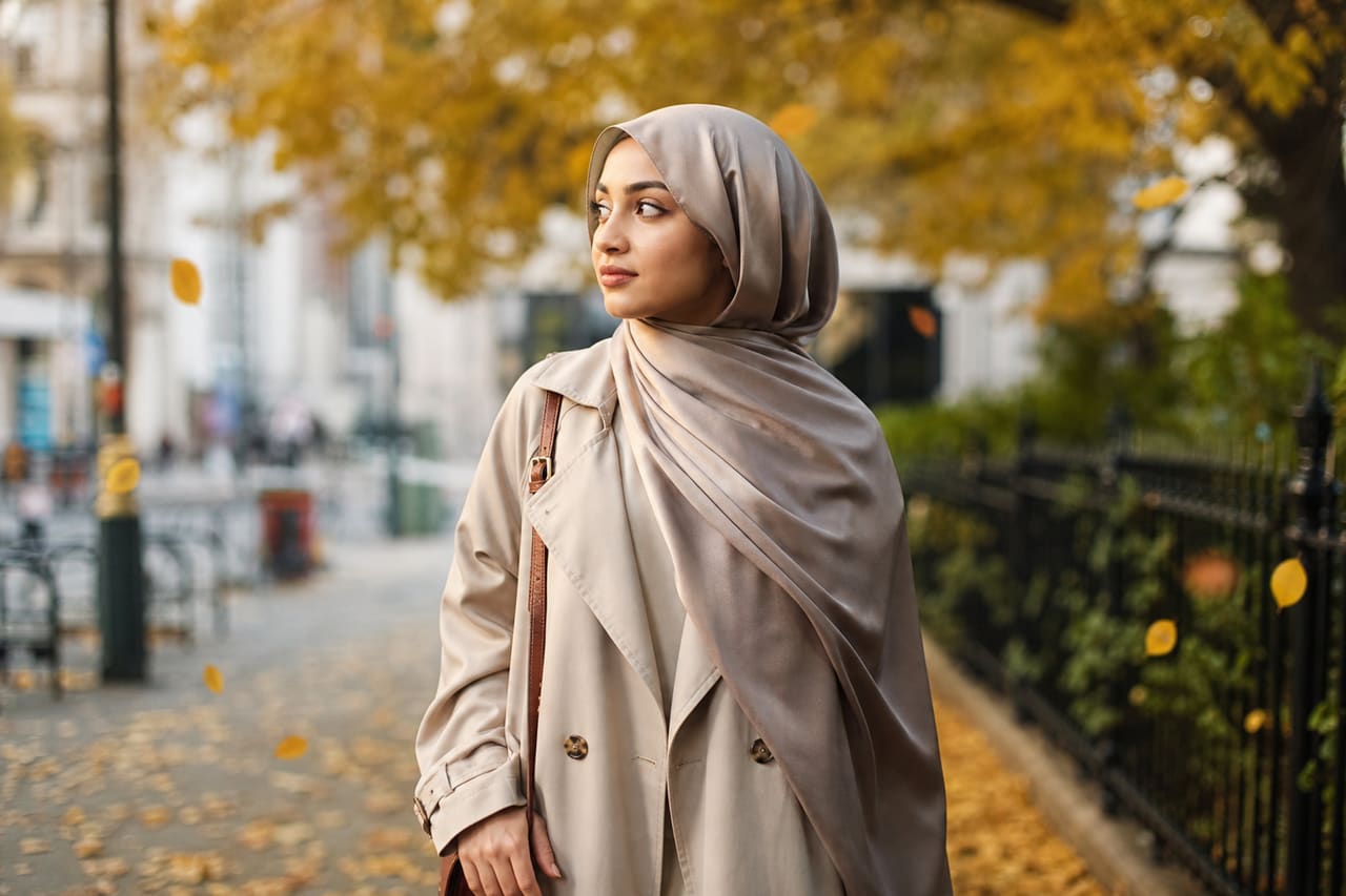 Muslim Woman Wearing a Silk Hijab in an Autumn Park