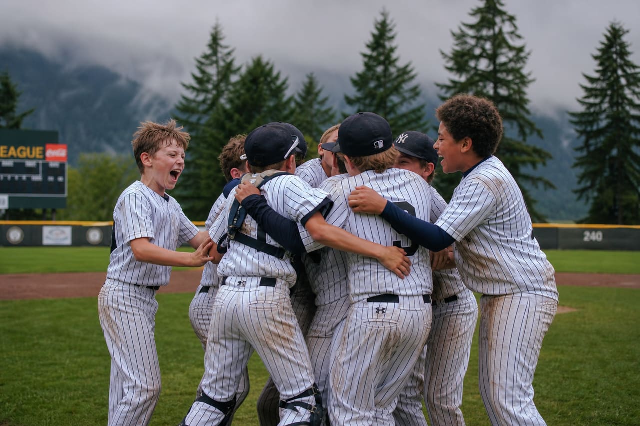 Youth Baseball Players Celebrating a Win in a Portland Park