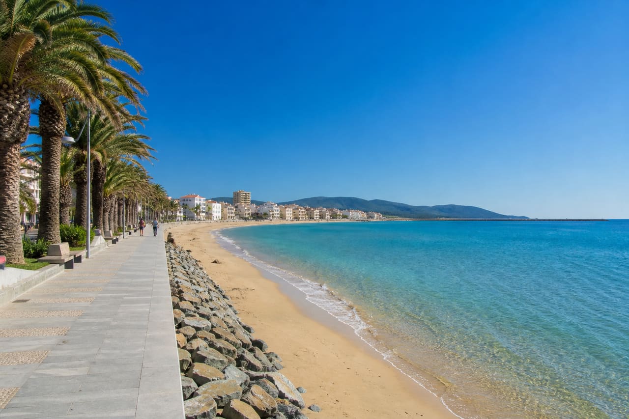 Sunny Coastal View of San Vincenzo Beach and Promenade