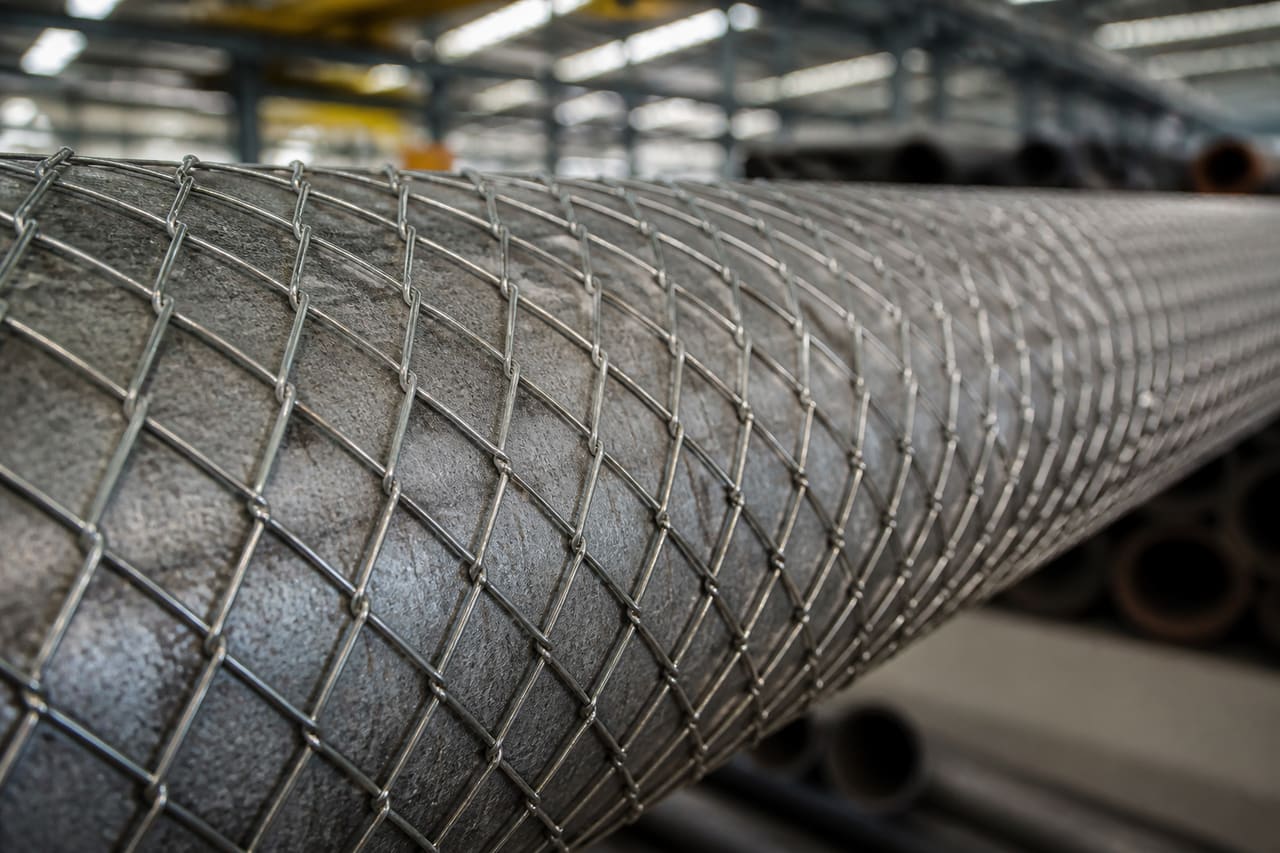 Industrial Diamond Mesh Wrap Applied to Steel Piping