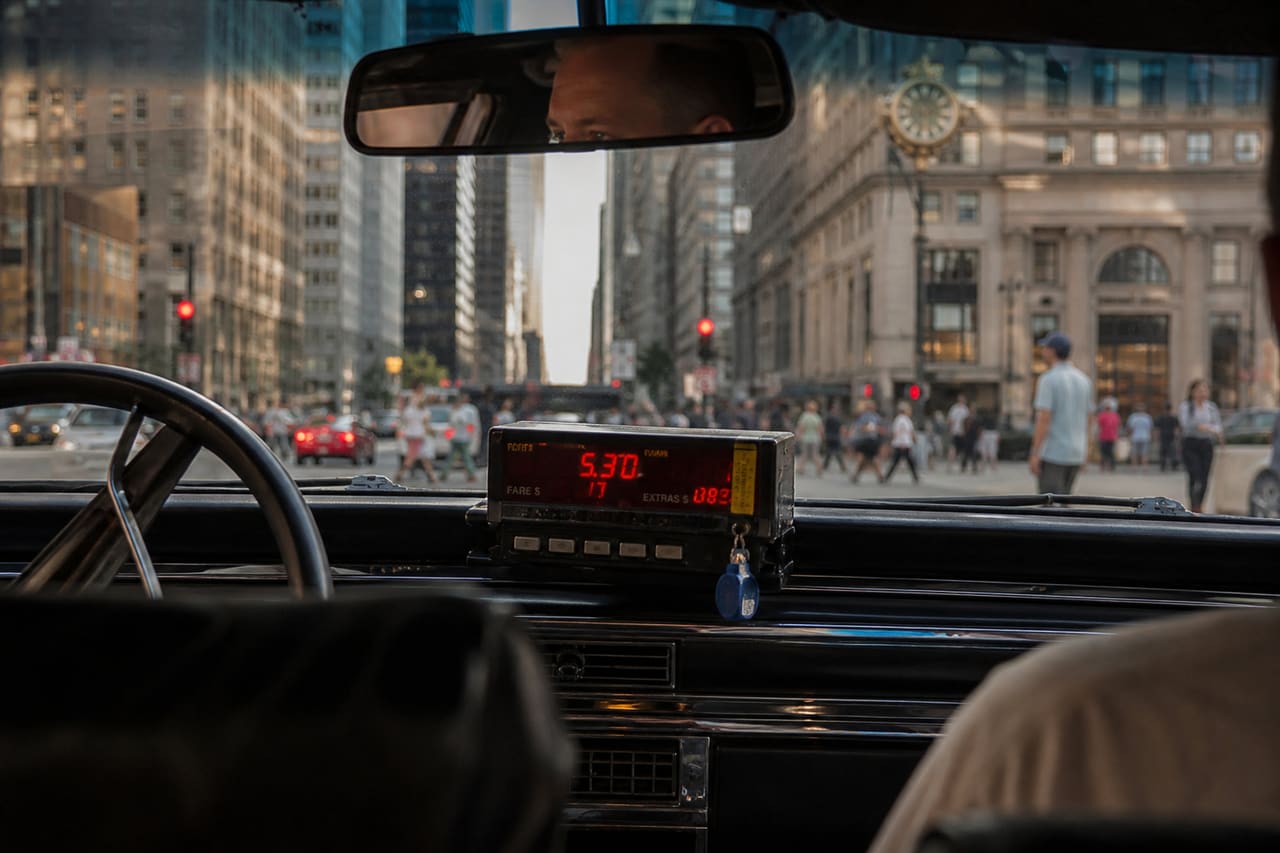 Yellow Taxi Cab Fare Meter on a Chicago Street