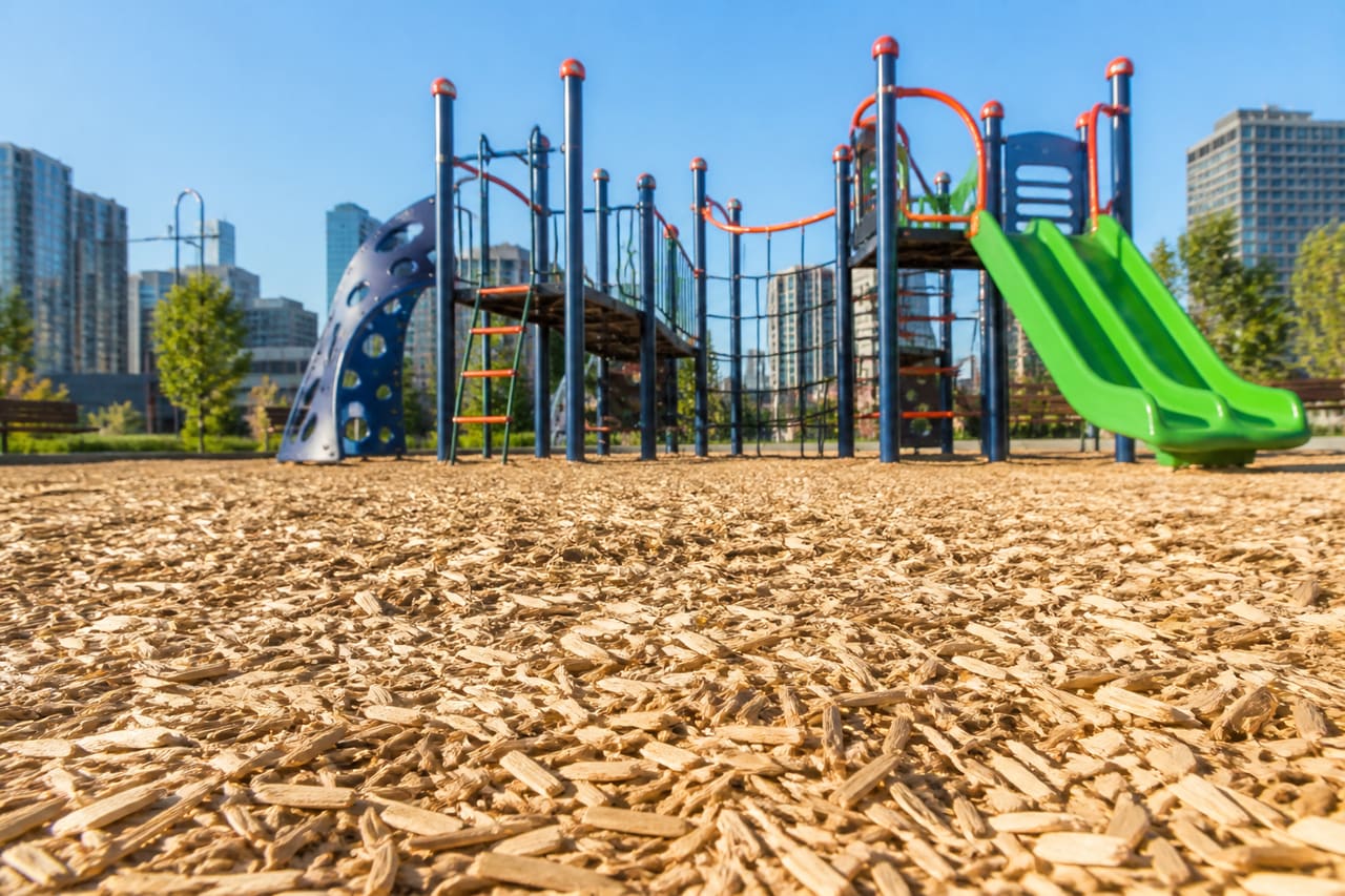 Fresh Engineered Wood Fiber Mulch on a Modern City Playground