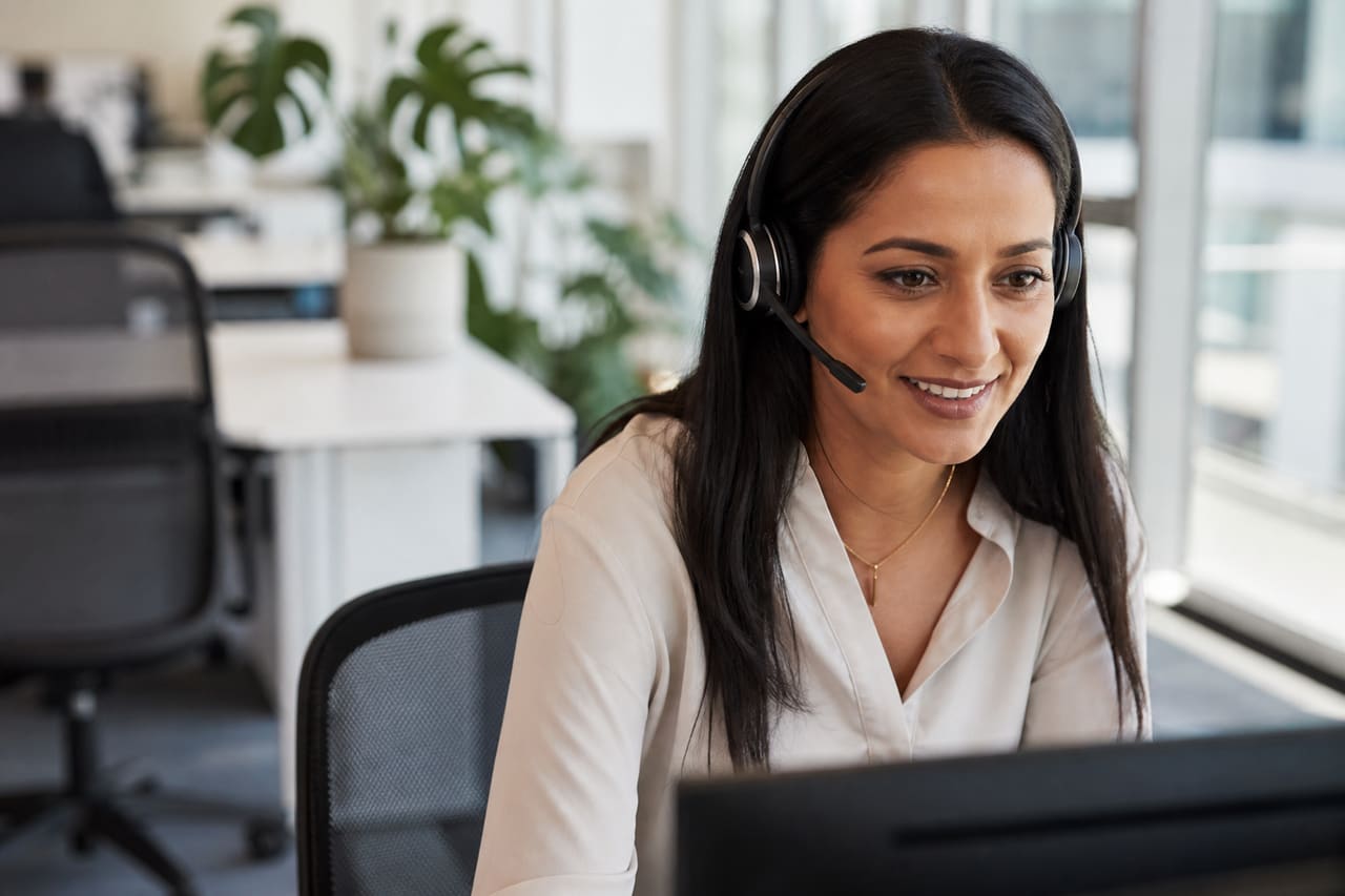 Customer Service Representative Assisting Client in Modern Office